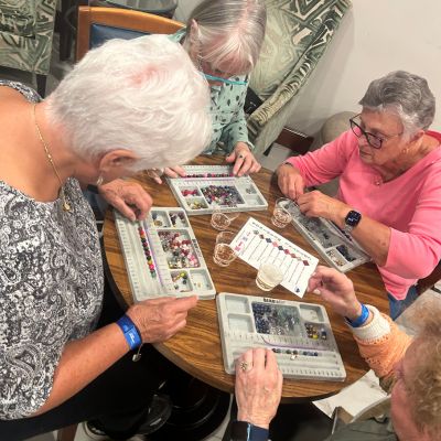 Church group making bracelets together